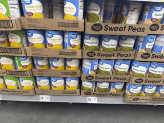 Canned corn and sweet peas stacked